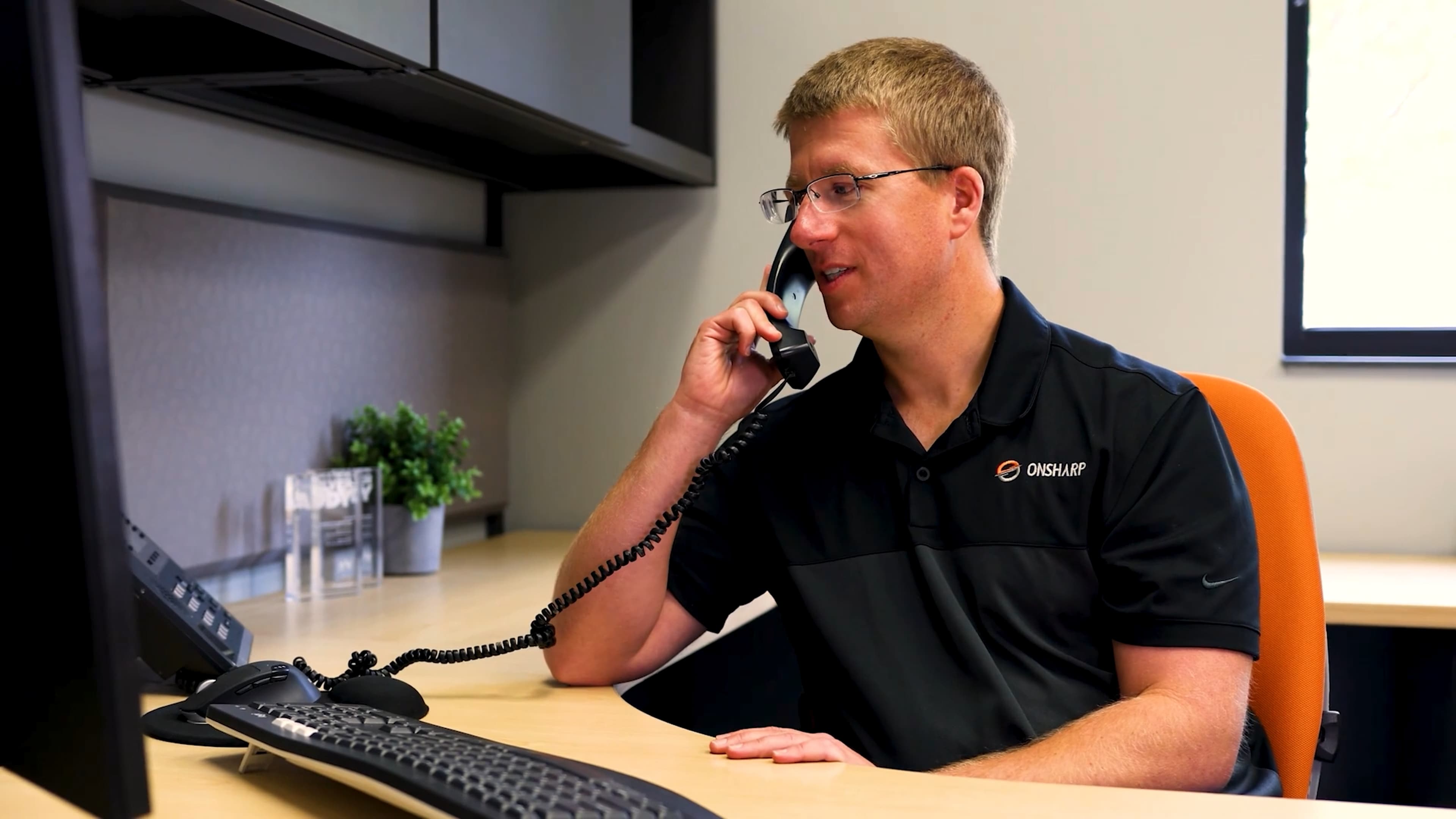 Jake Dahl speaking with a customer on the phone