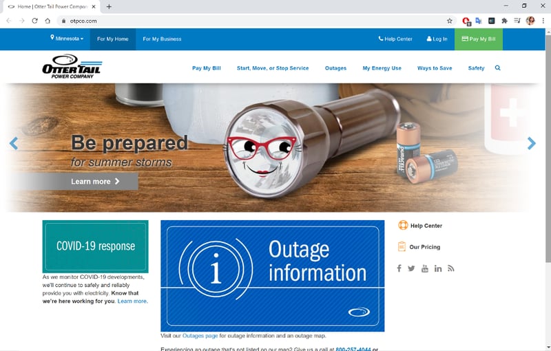 Screenshot of Otter Tail Power Company homepage depicting a flashlight with a smily cartoon face wearing glasses